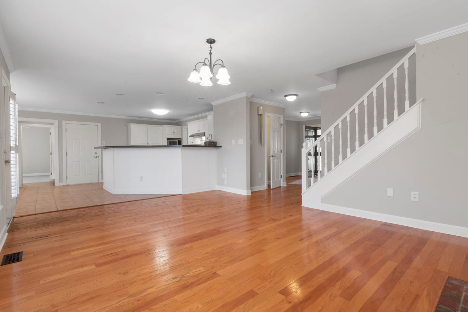 Completed golden oak hardwood flooring in an open-plan Las Vegas home