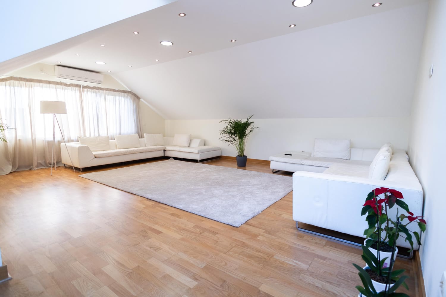 Light oak flooring in a bright Las Vegas attic living room
