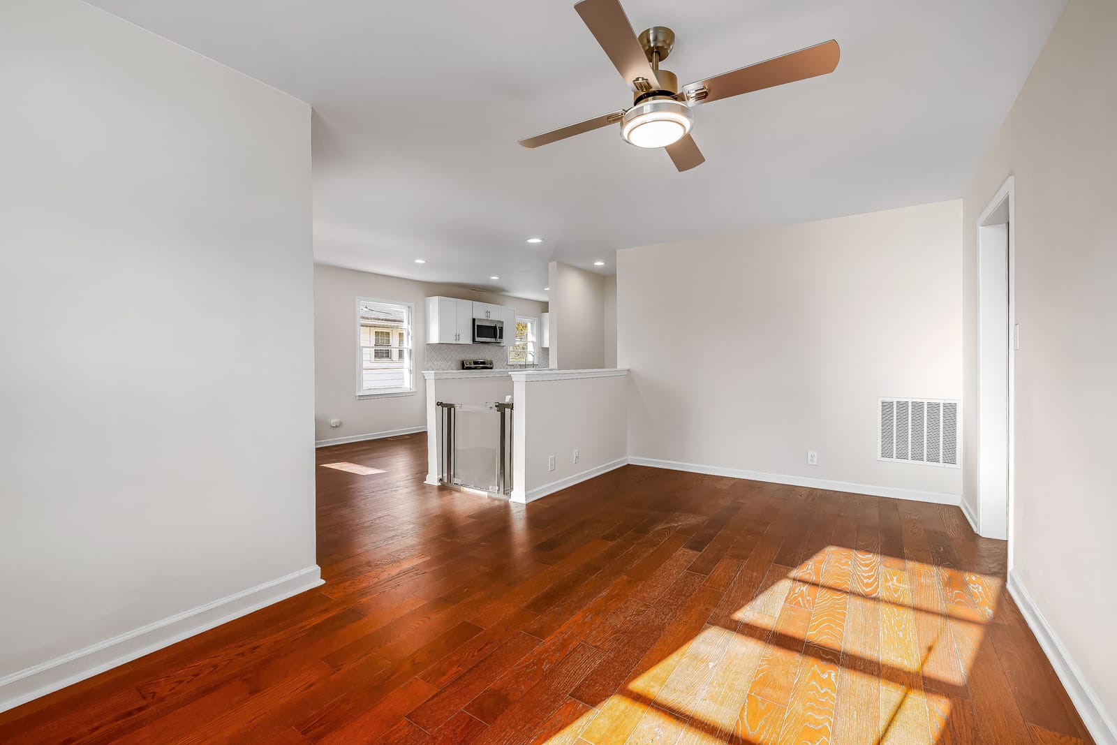 Empty room with new cherry hardwood flooring during a Las Vegas floor replacement