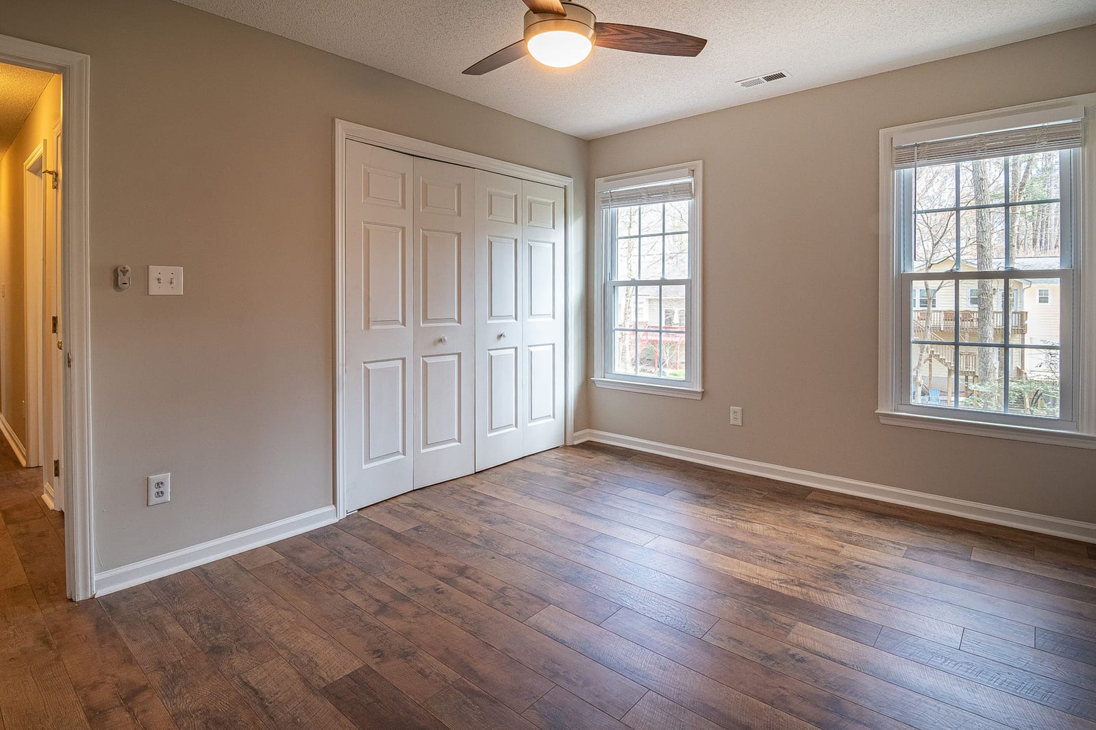 Dark hand-scraped hardwood flooring in a Las Vegas bedroom