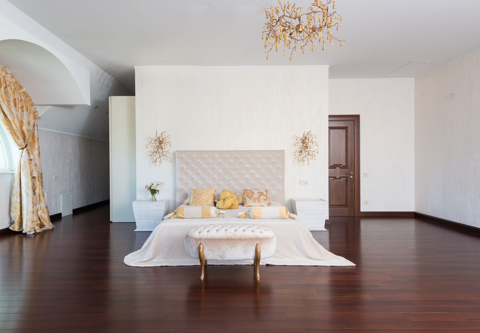 Dark mahogany hardwood flooring in an elegant Las Vegas master bedroom