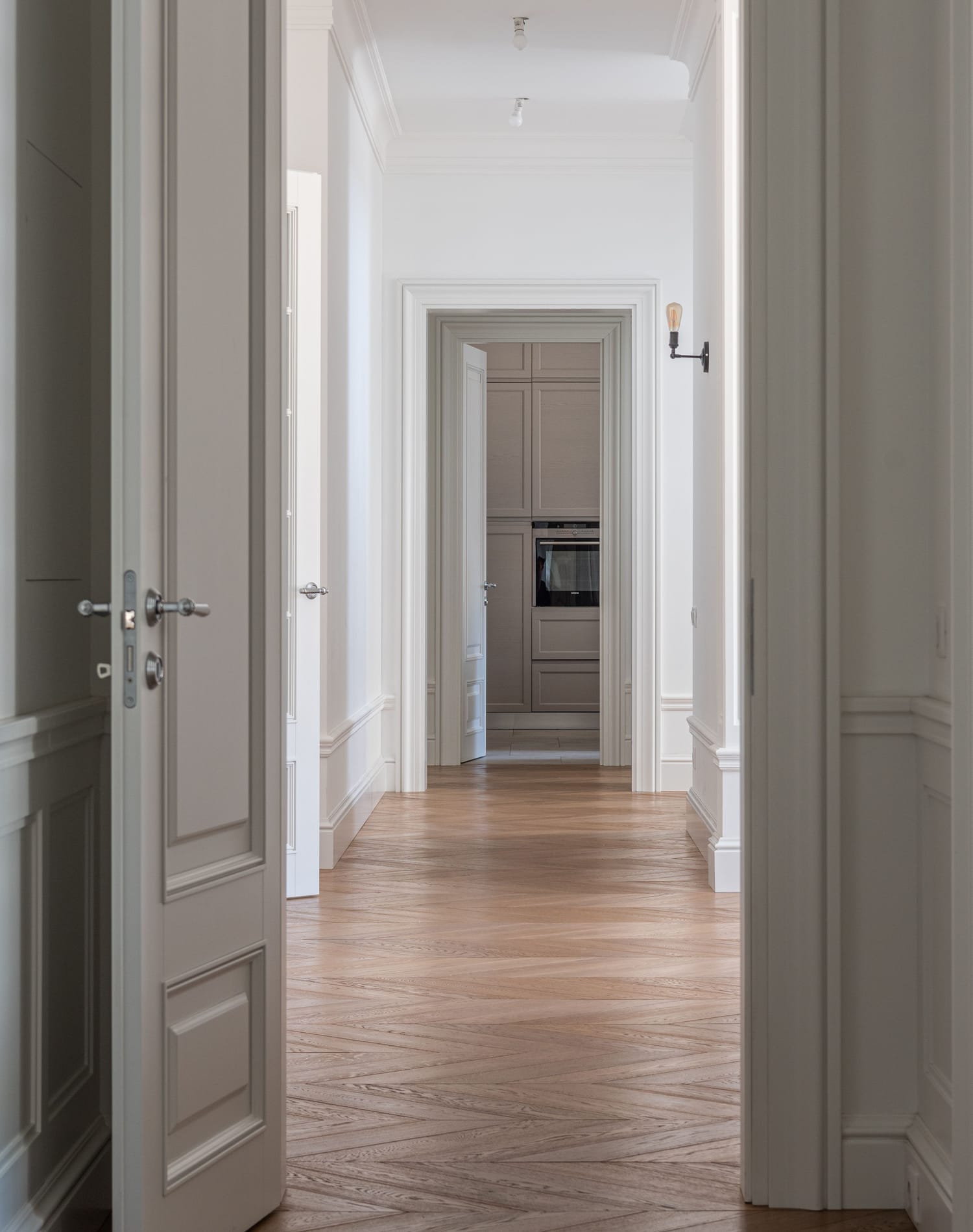 Herringbone wood flooring in an elegant Las Vegas hallway