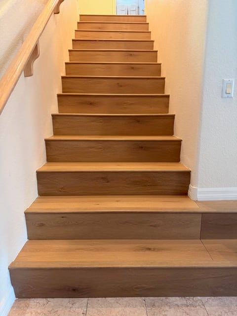 Stair flooring installation project with oak wood treads and risers in a Las Vegas home
