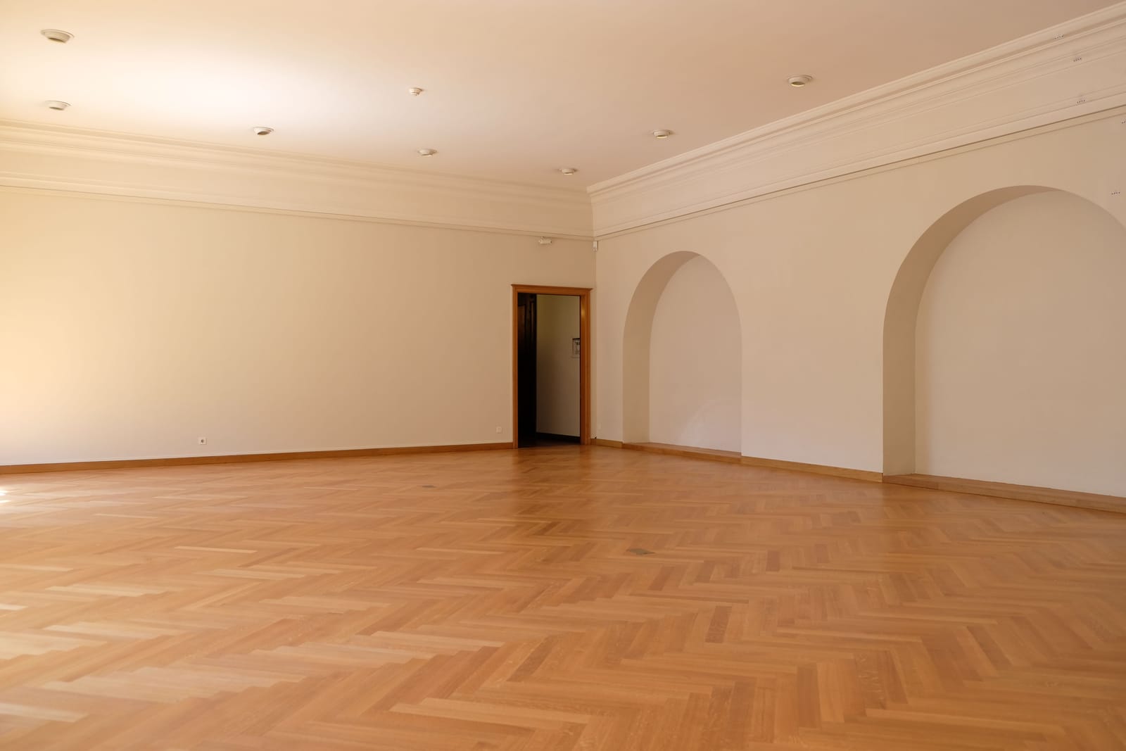 Parquet wood flooring in a spacious, light-filled Las Vegas room