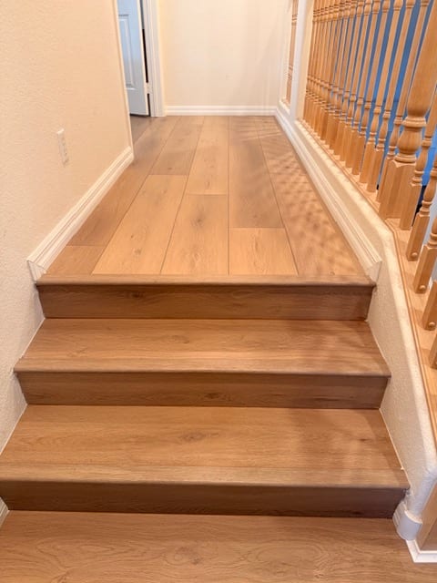 Wood-look flooring on a staircase landing and steps in a Las Vegas home